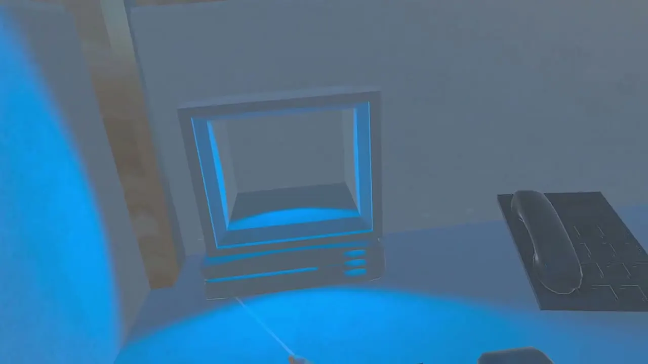 The monitor screen glowing blue as the player shrinks into the wallpaper