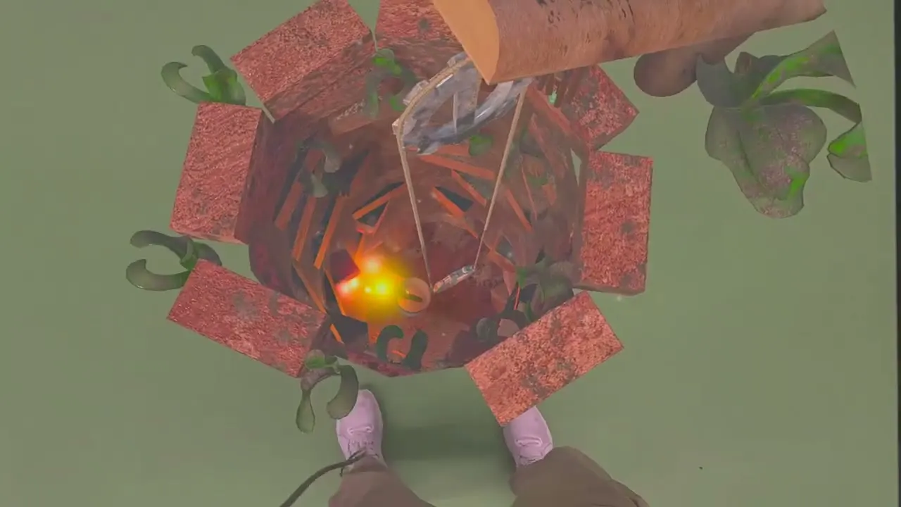 Looking straight down into the lit well, the player's feet visible below